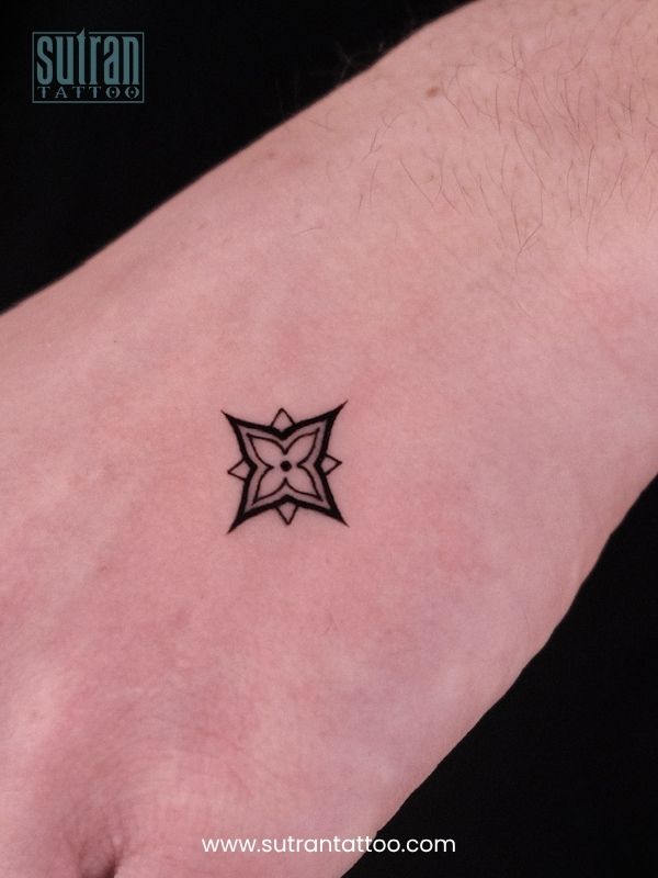 Small Geometric Symbol Tattoo