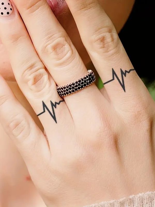 Mini heartbeat finger tattoo design to show personality