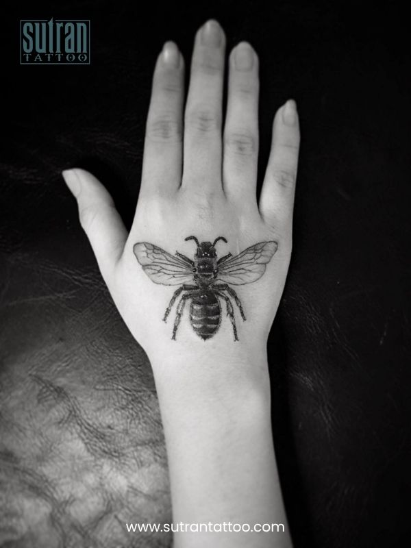 Attractive back of hand tattoos