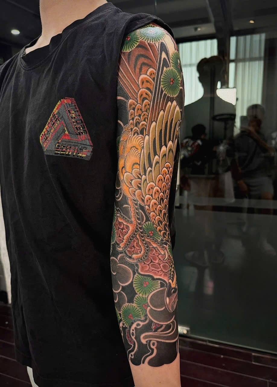 Large Asian-style tattoo at Sutran Tattoo Studio — design 127