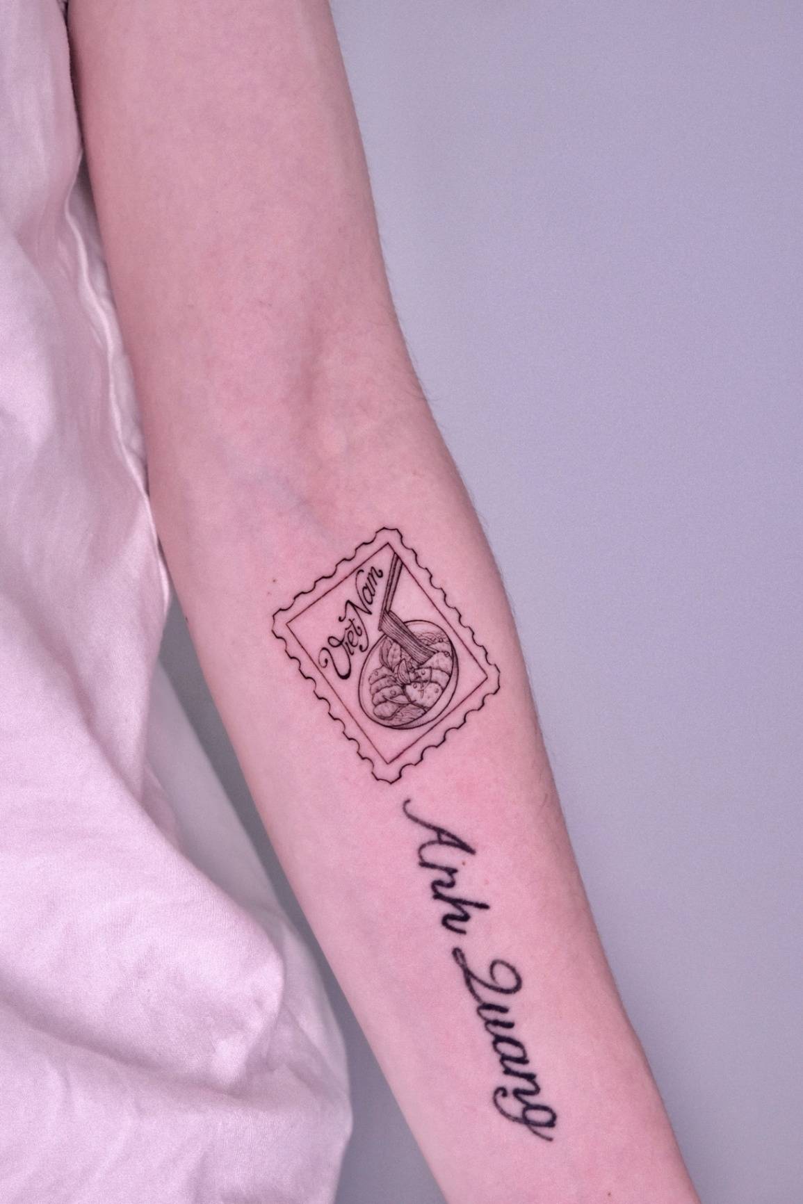 Postage stamp, lantern and hand fan tattoo at Sutran Tattoo Studio — design 123