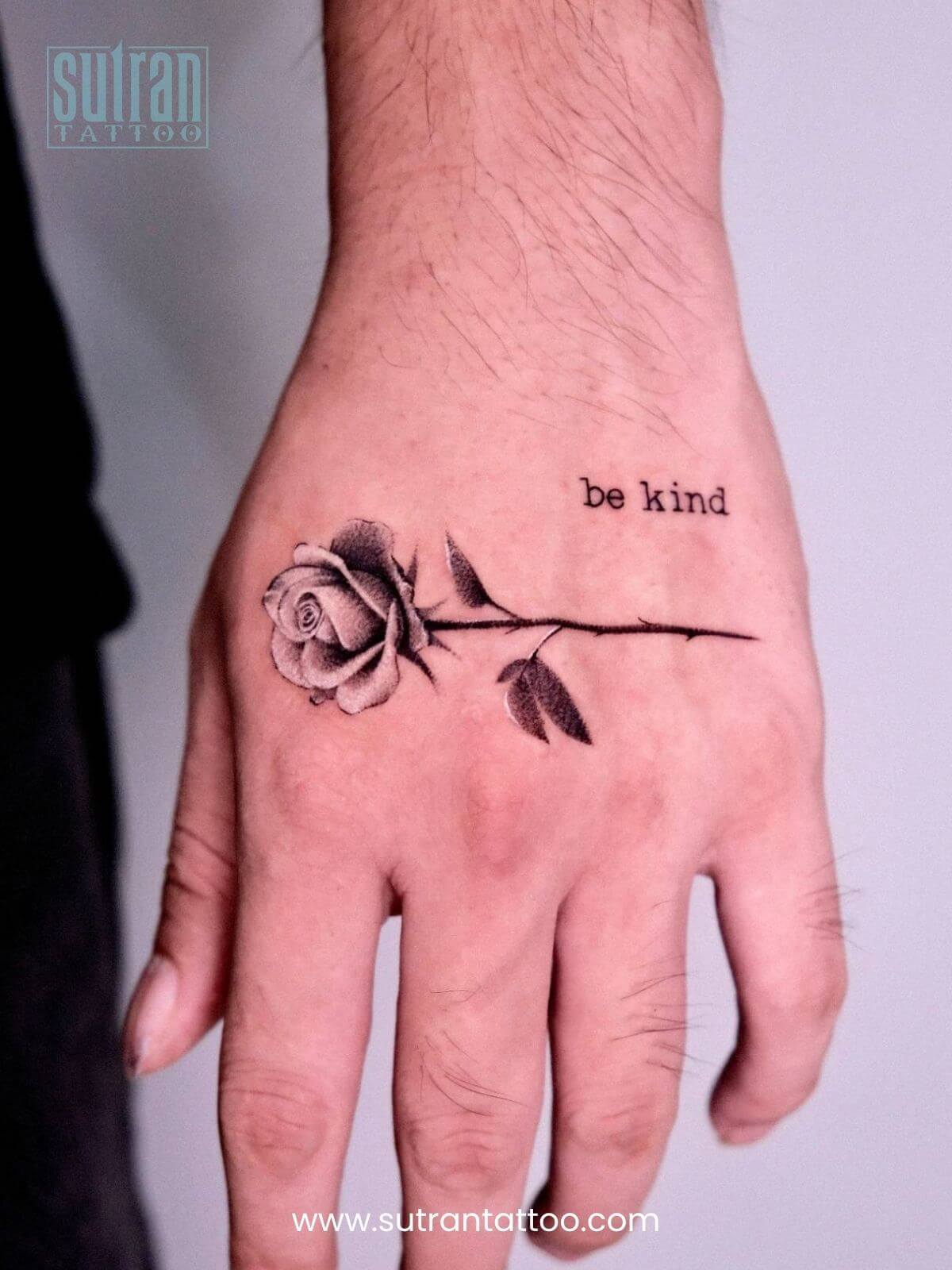 Rose tattoo on hand