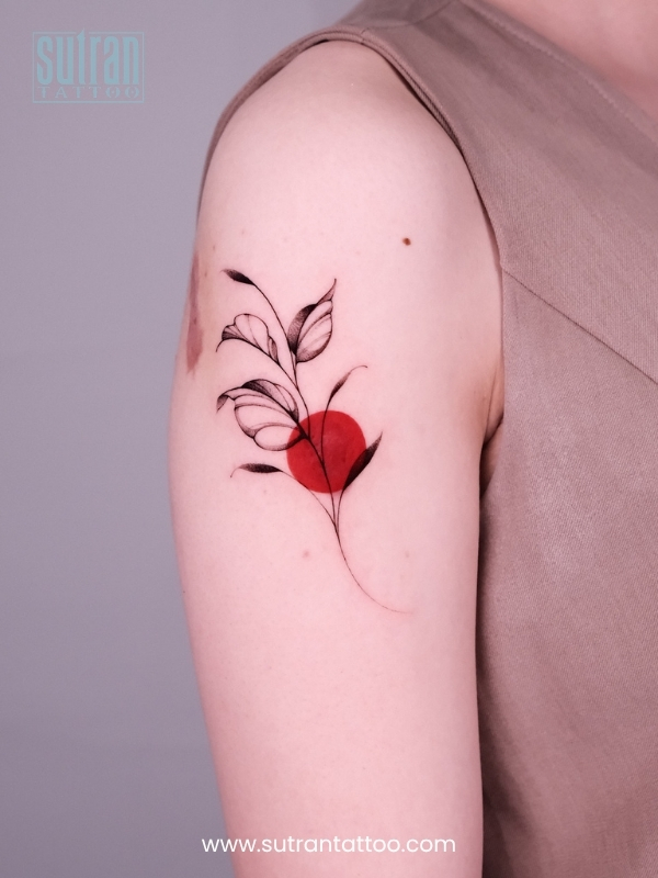 Fine line flower tattoo on forearm