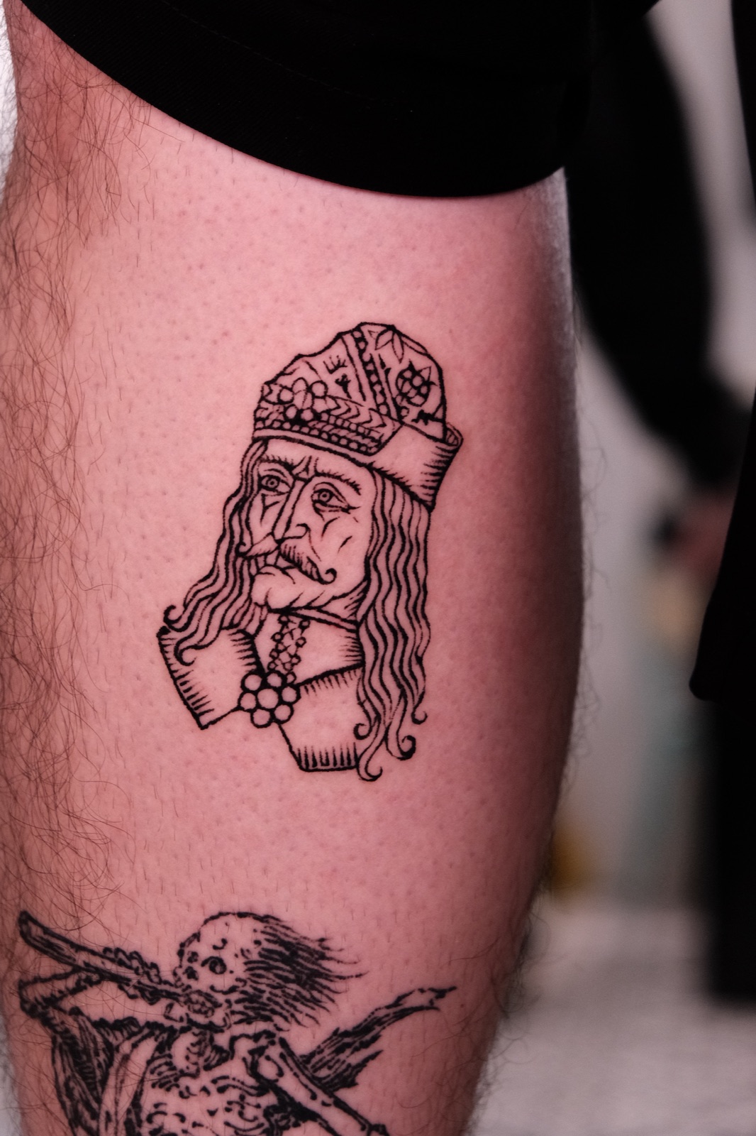 Blackwork Crowned King Portrait Tattoo on Thigh