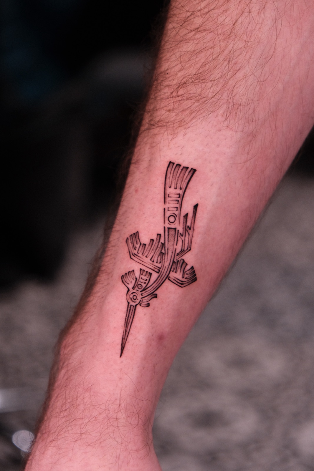 Blackwork geometric abstract tattoo on the calf