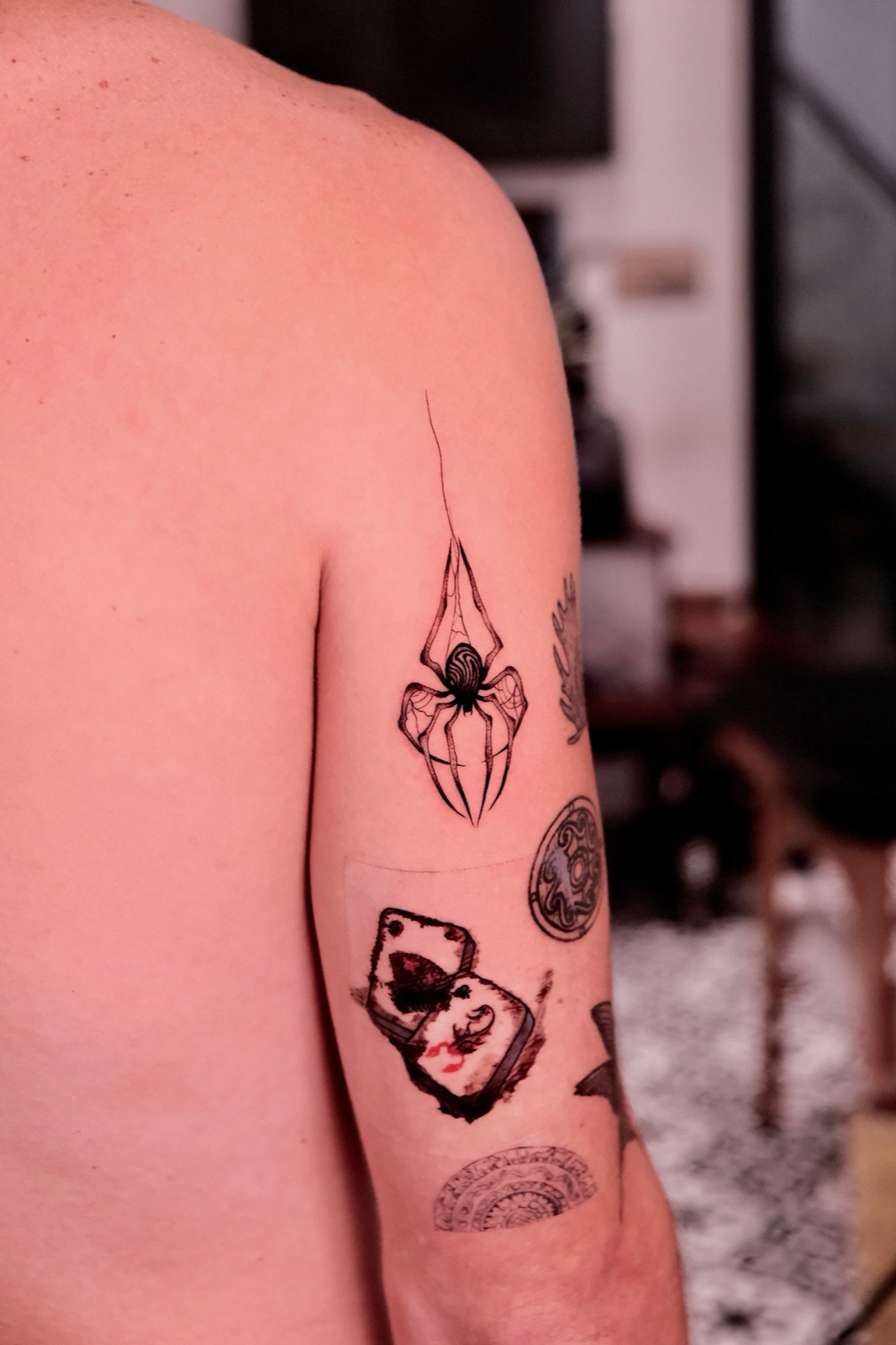 Blackwork Spider Tattoo on Upper Arm