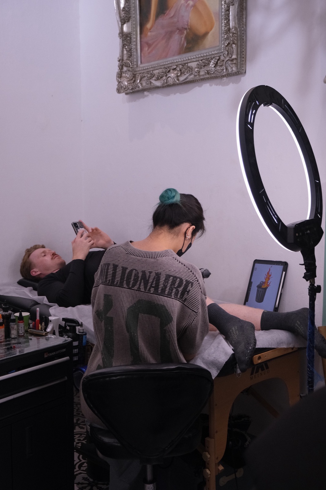Piercing artist preparing sterile tools at Su Tran Tattoo Studio